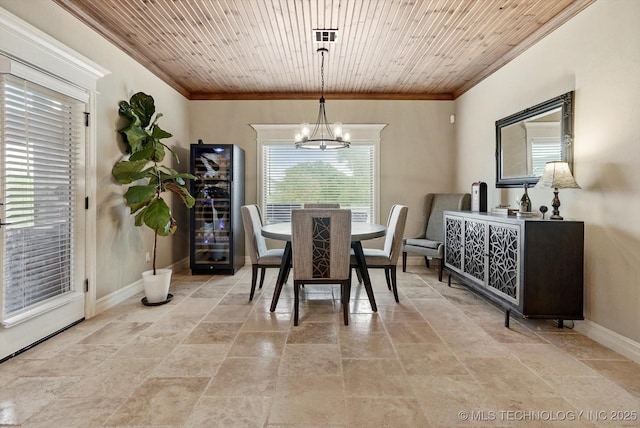 10611 N 159th E Ave, Owasso, OK 74055 - dining area with ornamental molding, beverage cooler, stone tile floors, a chandelier, and wooden ceiling