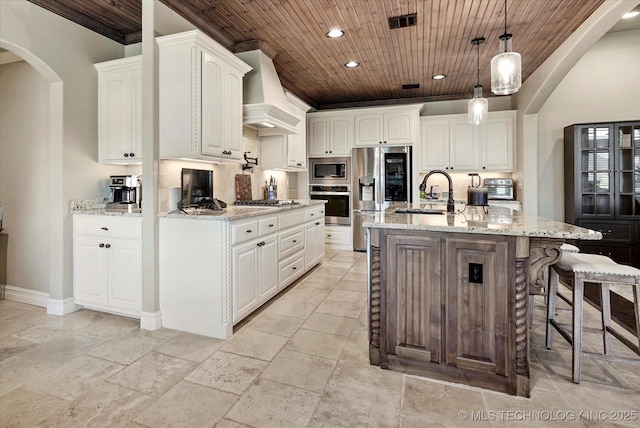 10611 N 159th E Ave, Owasso, OK 74055 - kitchen featuring appliances with stainless steel finishes, wood ceiling, custom exhaust hood, stone tile floors, and recessed lighting