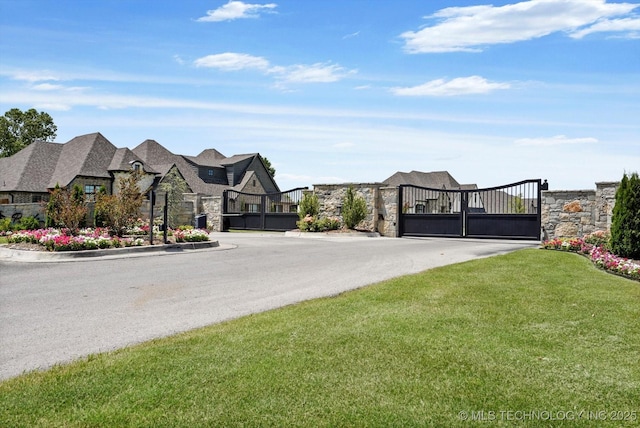 10611 N 159th E Ave, Owasso, OK 74055 - view of asphalt road with a gate, a gated entry, and a residential view