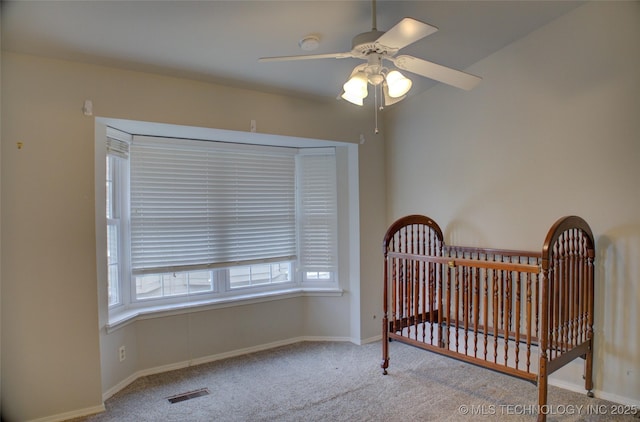 1420 S Frisco Ave Unit 6, Tulsa, OK 74119 - bedroom with carpet flooring, multiple windows, and a nursery area