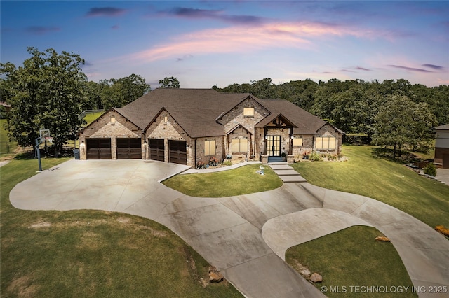13380 S Garrett St, Sapulpa, OK 74066 - view of front of house with concrete driveway, stone siding, a front yard, french doors, and an attached garage