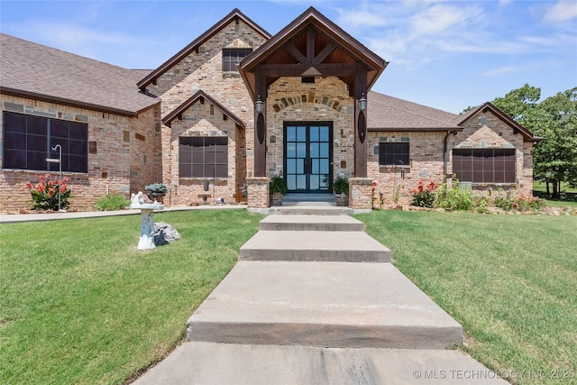 13380 S Garrett St, Sapulpa, OK 74066 - french country style house with a front lawn, brick siding, french doors, and a shingled roof