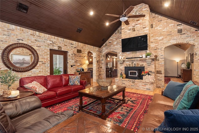 13380 S Garrett St, Sapulpa, OK 74066 - living room featuring arched walkways, ceiling fan, high vaulted ceiling, wooden ceiling, and wood finished floors
