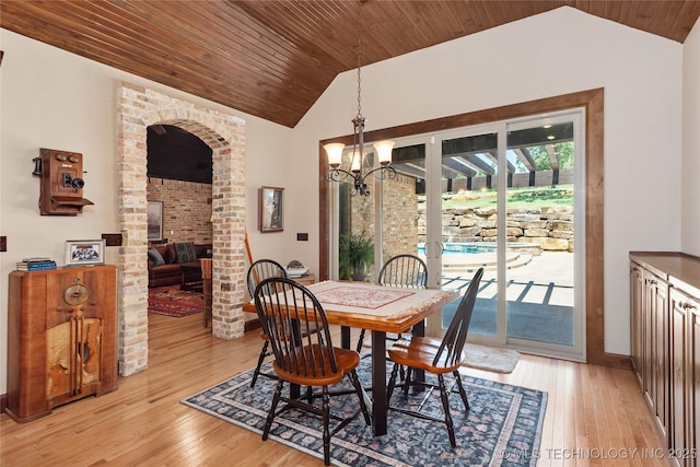 13380 S Garrett St, Sapulpa, OK 74066 - dining area with lofted ceiling, wood ceiling, light wood-type flooring, a chandelier, and arched walkways