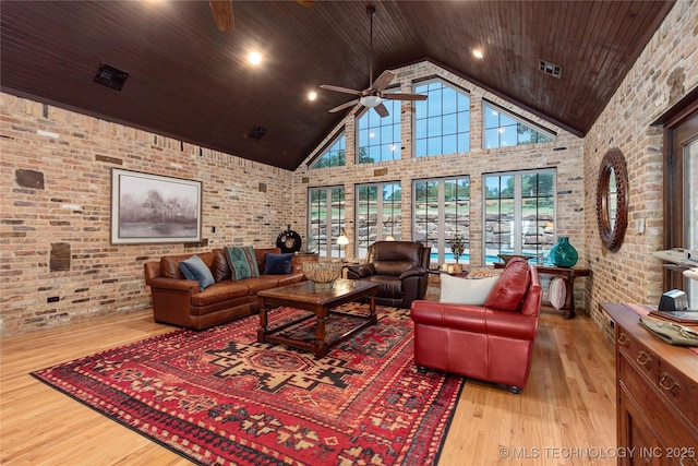 13380 S Garrett St, Sapulpa, OK 74066 - living area featuring ceiling fan, high vaulted ceiling, wood ceiling, wood finished floors, and brick wall
