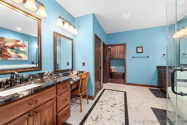 13380 S Garrett St, Sapulpa, OK 74066 - full bathroom featuring vanity, marble look tile flooring, and a stall shower