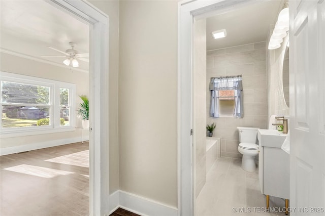 212 S Phoenix Ave, Tulsa, OK 74127 - bathroom with vanity, a tub, and ceiling fan