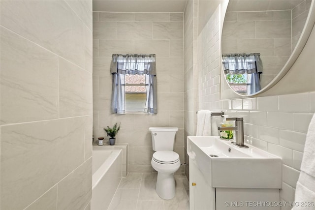 212 S Phoenix Ave, Tulsa, OK 74127 - bathroom featuring tile walls, a tub to relax in, tile patterned flooring, and vanity