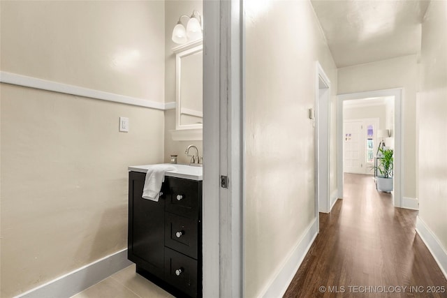 212 S Phoenix Ave, Tulsa, OK 74127 - bathroom featuring vanity and wood finished floors