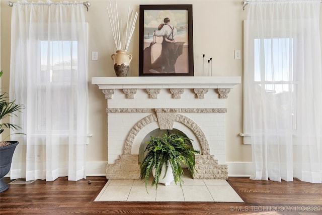 212 S Phoenix Ave, Tulsa, OK 74127 - detailed view of wood finished floors and a fireplace
