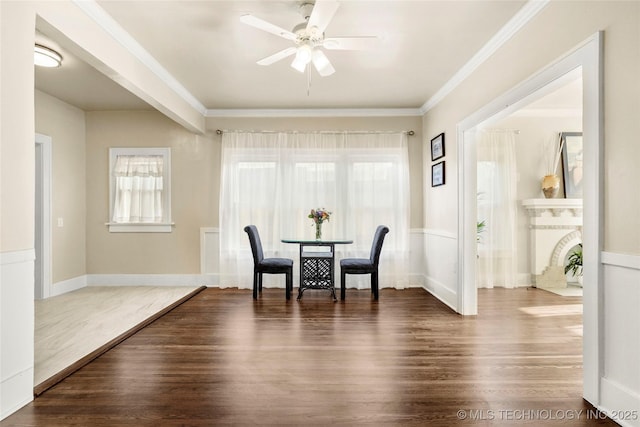 212 S Phoenix Ave, Tulsa, OK 74127 - dining space featuring healthy amount of natural light, dark wood-style floors, a ceiling fan, and crown molding