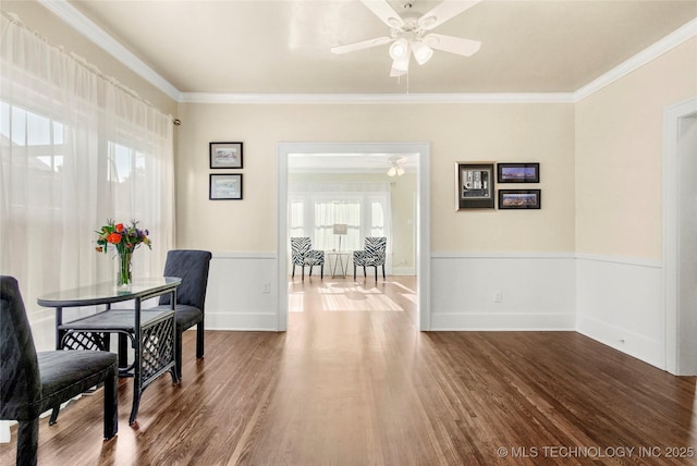212 S Phoenix Ave, Tulsa, OK 74127 - dining space with ceiling fan, ornamental molding, wood finished floors, and a wainscoted wall