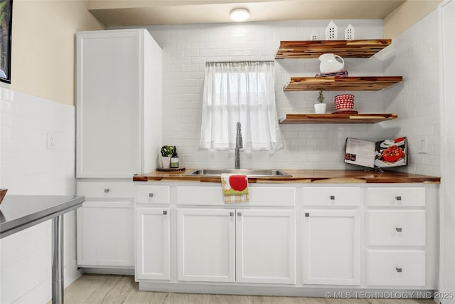 212 S Phoenix Ave, Tulsa, OK 74127 - kitchen featuring white cabinets, decorative backsplash, and open shelves