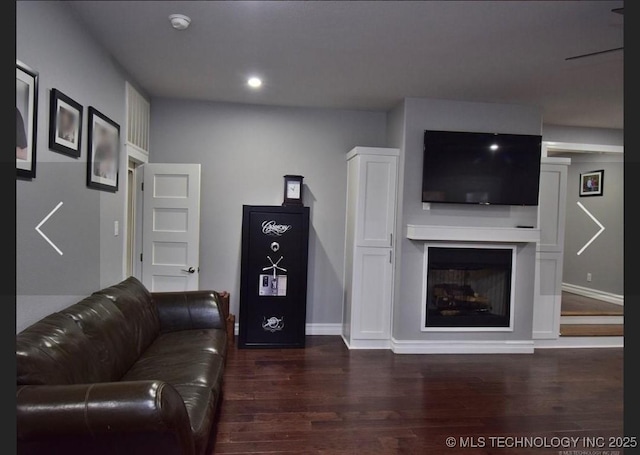 610 W Delaware St, Tahlequah, OK 74464 - living room with dark wood-style floors, recessed lighting, and a fireplace