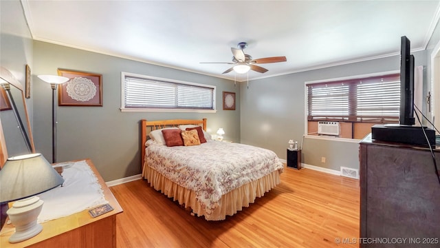 4040 E 46th Pl, Tulsa, OK 74135 - bedroom with crown molding, light wood-style floors, multiple windows, cooling unit, and a ceiling fan