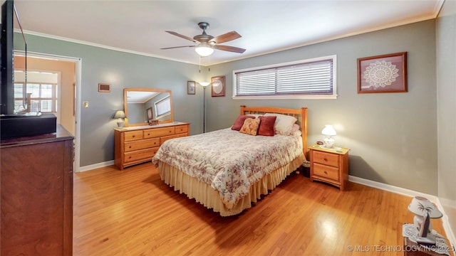 4040 E 46th Pl, Tulsa, OK 74135 - bedroom featuring light wood-type flooring, crown molding, and a ceiling fan