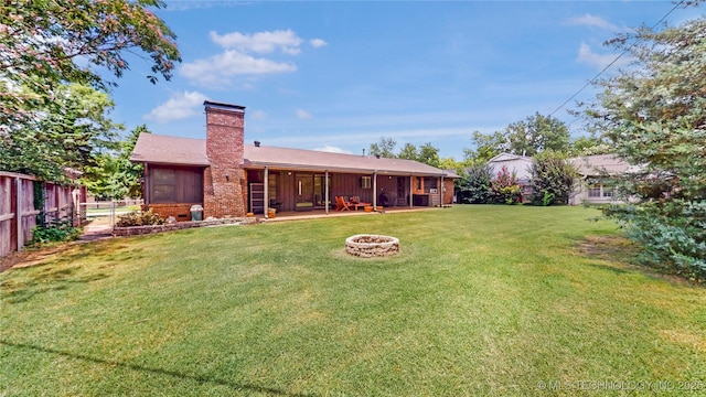 4040 E 46th Pl, Tulsa, OK 74135 - rear view of property featuring an outdoor fire pit and a chimney