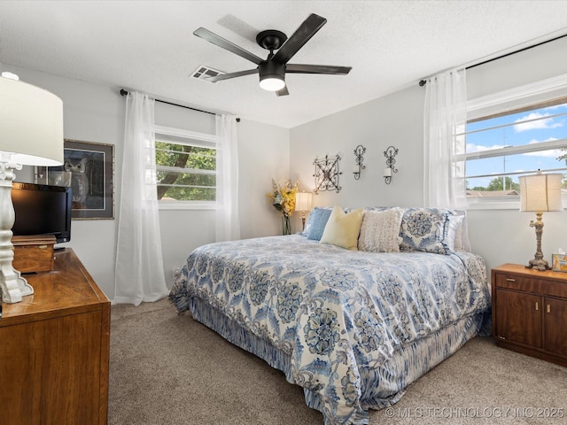 1726 Harned Dr, Bartlesville, OK 74006 - bedroom with light carpet and a ceiling fan
