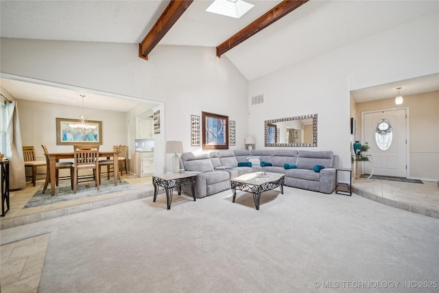 8736 E 59th St, Tulsa, OK 74145 - carpeted living area featuring beamed ceiling, a chandelier, high vaulted ceiling, and a skylight