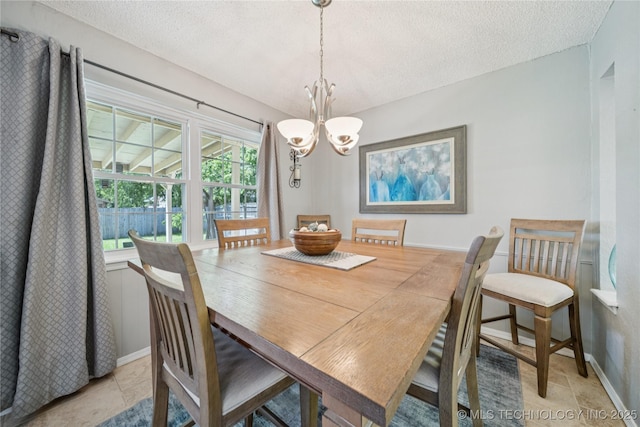 8736 E 59th St, Tulsa, OK 74145 - dining area with a chandelier and a textured ceiling
