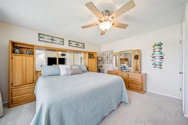 8736 E 59th St, Tulsa, OK 74145 - bedroom featuring light colored carpet, a textured ceiling, and ceiling fan