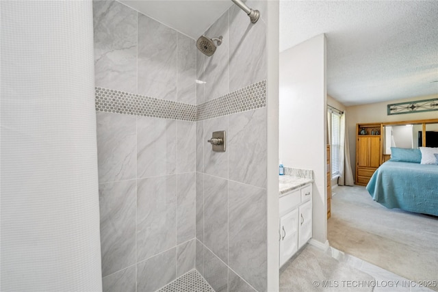 8736 E 59th St, Tulsa, OK 74145 - full bathroom with ensuite bathroom, a tile shower, vanity, and a textured ceiling