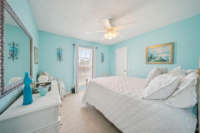 8736 E 59th St, Tulsa, OK 74145 - bedroom featuring light colored carpet, a textured ceiling, and a ceiling fan