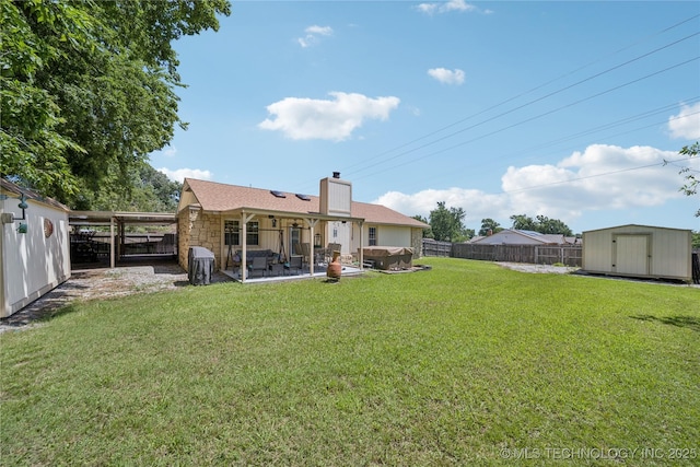 8736 E 59th St, Tulsa, OK 74145 - rear view of house featuring a shed, a fenced backyard, a chimney, and a patio