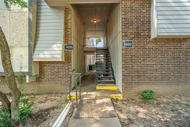 4660 E 68th St Unit 179, Tulsa, OK 74136 - doorway to property with brick siding