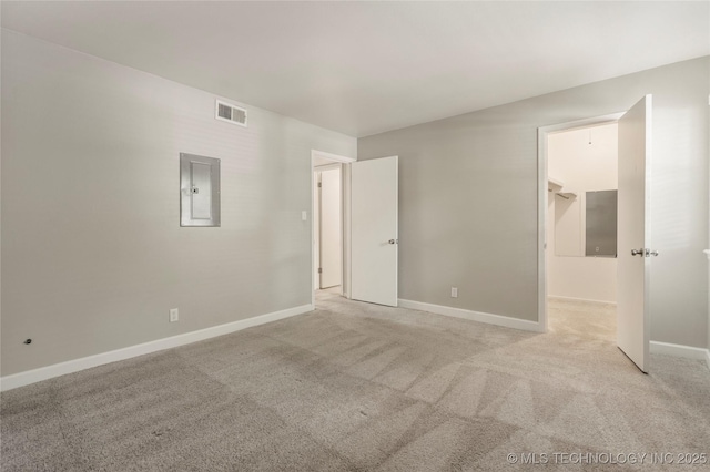 4660 E 68th St Unit 179, Tulsa, OK 74136 - unfurnished bedroom featuring electric panel and light carpet