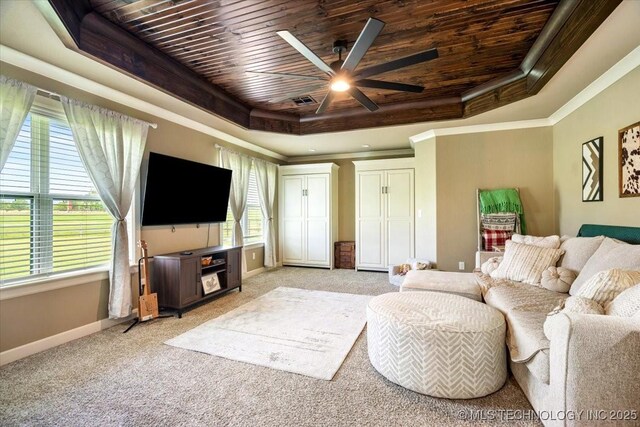 14610 N 144th E Ave, Collinsville, OK 74021 - living room with wood ceiling, a tray ceiling, a ceiling fan, light carpet, and ornamental molding