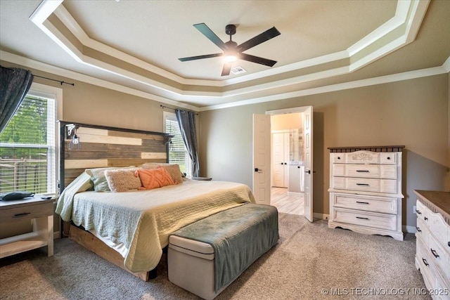 14610 N 144th E Ave, Collinsville, OK 74021 - bedroom with a tray ceiling, ornamental molding, light colored carpet, multiple windows, and ceiling fan