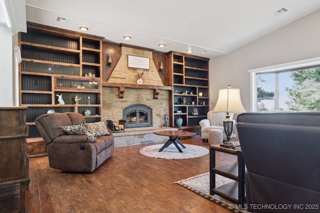 30150 S County Road 4430, Stigler, OK 74462 - living area with wood finished floors, a fireplace, recessed lighting, and built in shelves