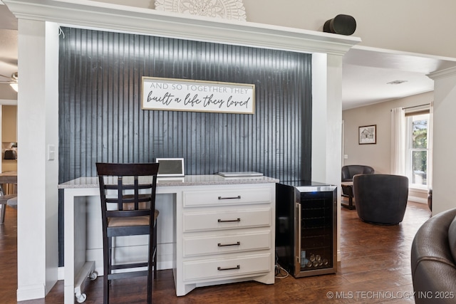 30150 S County Road 4430, Stigler, OK 74462 - home office with wine cooler, dark wood-type flooring, and a ceiling fan