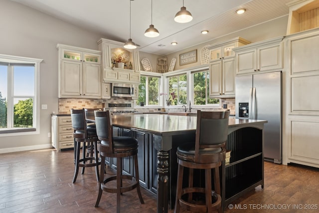 30150 S County Road 4430, Stigler, OK 74462 - kitchen featuring stainless steel appliances, a center island, backsplash, plenty of natural light, and recessed lighting