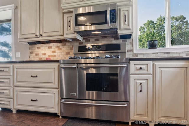 30150 S County Road 4430, Stigler, OK 74462 - kitchen featuring stainless steel appliances, decorative backsplash, dark countertops, and white cabinets