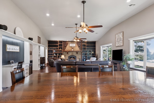 30150 S County Road 4430, Stigler, OK 74462 - living area featuring ceiling fan, built in features, a large fireplace, recessed lighting, and high vaulted ceiling