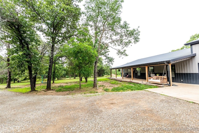 348550 E Parkside Dr, Pawnee, OK 74058 - view of yard with driveway and a porch