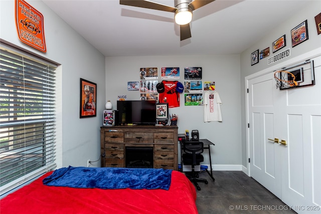 348550 E Parkside Dr, Pawnee, OK 74058 - bedroom with ceiling fan and a fireplace