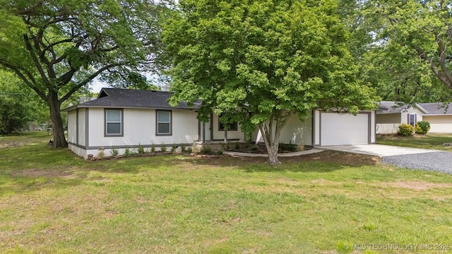 4010 E Harris, Muskogee, OK 74403 - single story home with driveway, an attached garage, and a front yard