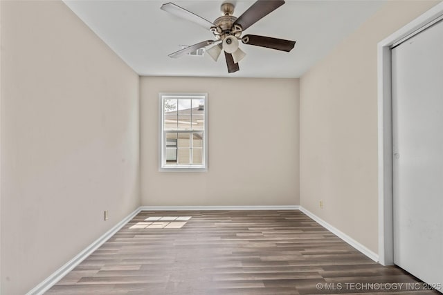 1624 7th NW, Ardmore, OK 73401 - spare room with wood finished floors and ceiling fan