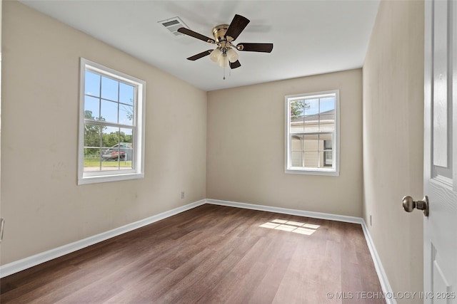 1624 7th NW, Ardmore, OK 73401 - spare room featuring wood finished floors and ceiling fan