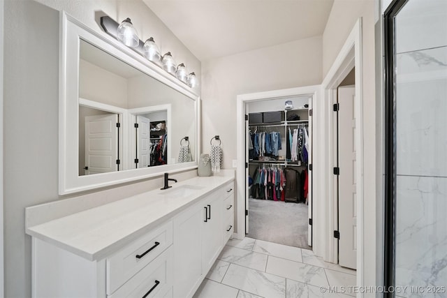 716 E 126th St, Jenks, OK 74037 - bathroom with a spacious closet, vanity, and marble finish floors