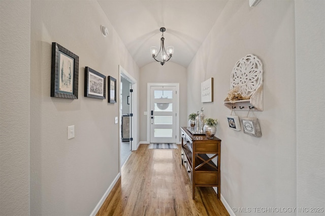 716 E 126th St, Jenks, OK 74037 - doorway featuring light wood-style flooring, a chandelier, and lofted ceiling