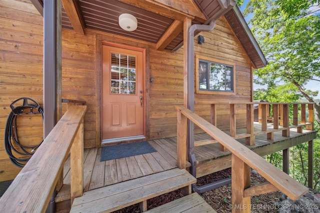 69125 E 252nd Rd, Wyandotte, OK 74370 - property entrance with a wooden deck