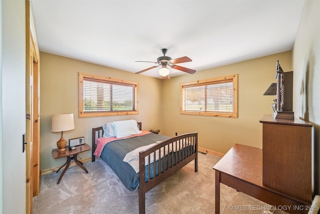69125 E 252nd Rd, Wyandotte, OK 74370 - bedroom with light carpet and ceiling fan