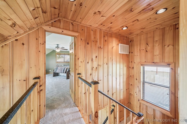 69125 E 252nd Rd, Wyandotte, OK 74370 - stairs featuring wood walls, carpet flooring, vaulted ceiling, wooden ceiling, and recessed lighting