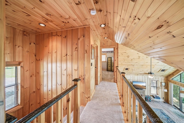 69125 E 252nd Rd, Wyandotte, OK 74370 - hall with an upstairs landing, wooden ceiling, wood walls, and lofted ceiling