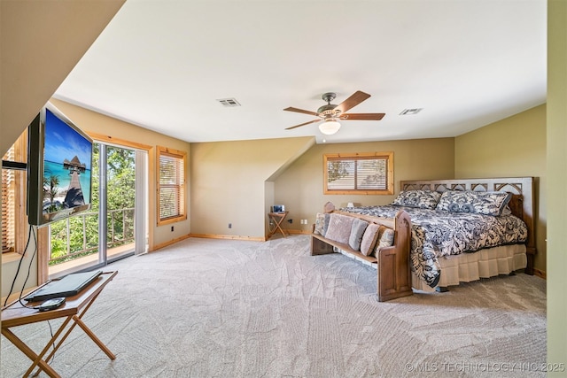 69125 E 252nd Rd, Wyandotte, OK 74370 - carpeted bedroom featuring multiple windows, access to outside, and ceiling fan