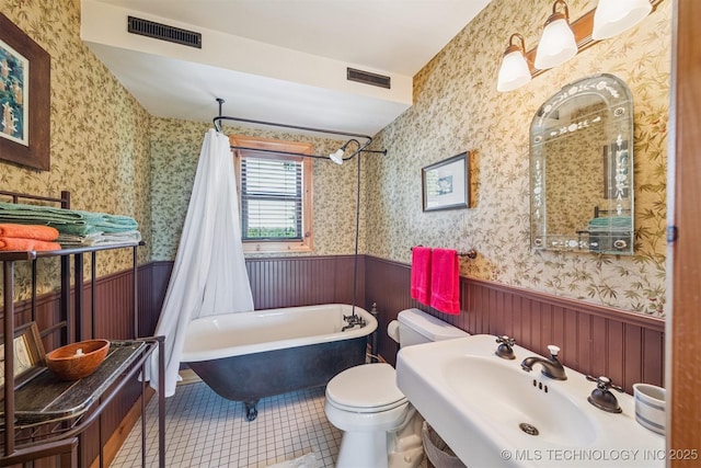 69125 E 252nd Rd, Wyandotte, OK 74370 - full bathroom with a wainscoted wall, shower / tub combo, wallpapered walls, and tile patterned flooring